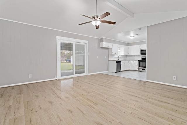 unfurnished living room featuring lofted ceiling with beams, ceiling fan, sink, and light hardwood / wood-style flooring