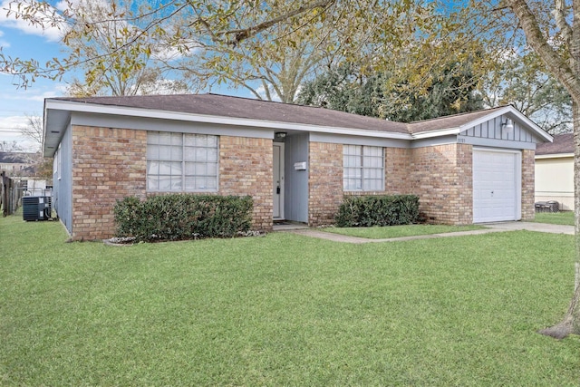 single story home featuring a garage, a front yard, and central AC unit