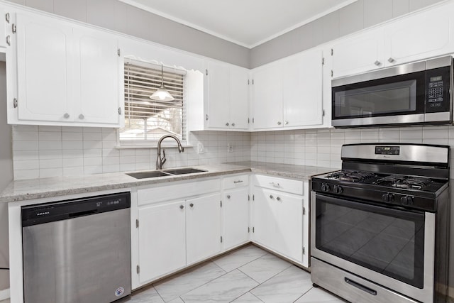 kitchen with tasteful backsplash, sink, stainless steel appliances, and white cabinets