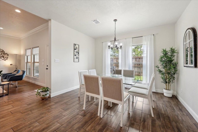 9270 Pampas St, Beaumont, TX 77713 - dining room featuring visible vents, a notable chandelier, and dark wood-type flooring