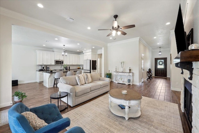 9270 Pampas St, Beaumont, TX 77713 - living area with visible vents, ceiling fan, baseboards, light wood-type flooring, and recessed lighting