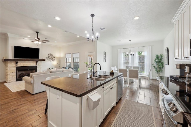 9270 Pampas St, Beaumont, TX 77713 - kitchen with visible vents, dishwasher, dark wood-type flooring, and a sink