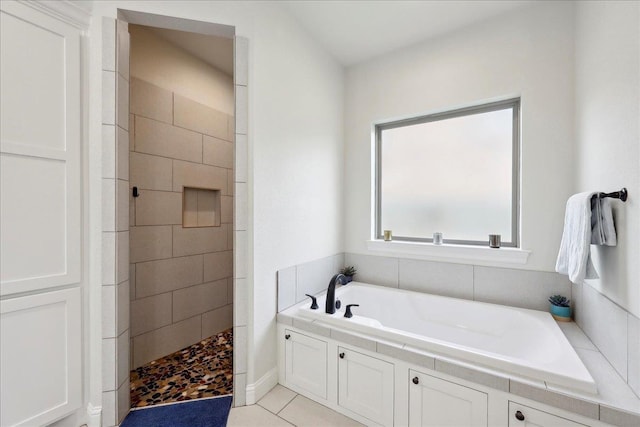 9270 Pampas St, Beaumont, TX 77713 - bathroom with a bath, tiled shower, and tile patterned floors