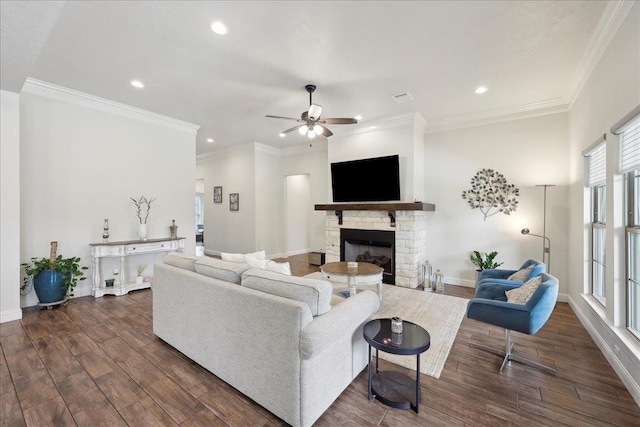 9270 Pampas St, Beaumont, TX 77713 - living area with dark wood-style floors, recessed lighting, ceiling fan, and a stone fireplace