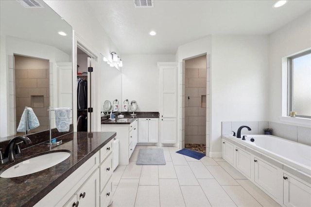 9270 Pampas St, Beaumont, TX 77713 - full bathroom with a garden tub, recessed lighting, tile patterned flooring, and tiled shower