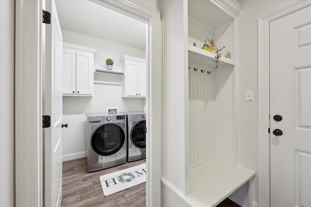 9270 Pampas St, Beaumont, TX 77713 - washroom with cabinet space, washing machine and clothes dryer, wood finished floors, and baseboards