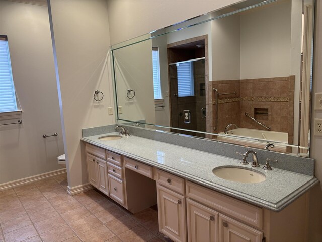 1470 Sheridan Ln, Beaumont, TX 77706 - bathroom with double vanity, a bath, a shower stall, toilet, and baseboards