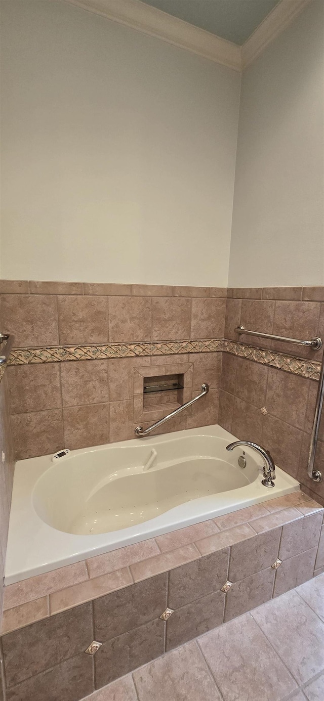 full bathroom with a garden tub and crown molding