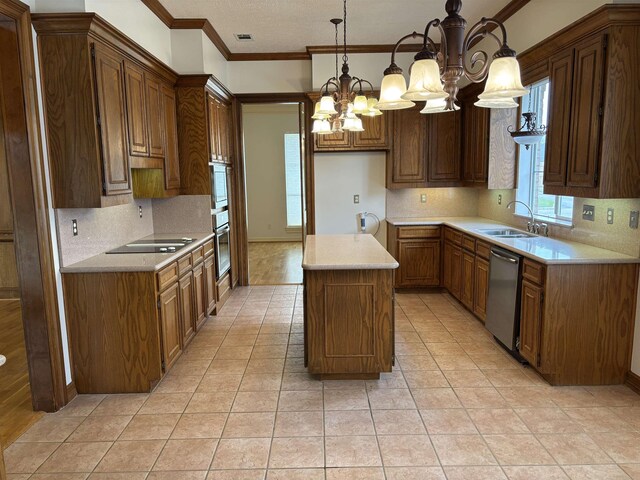 1470 Sheridan Ln, Beaumont, TX 77706 - kitchen with stainless steel appliances, a sink, a chandelier, tasteful backsplash, and a center island