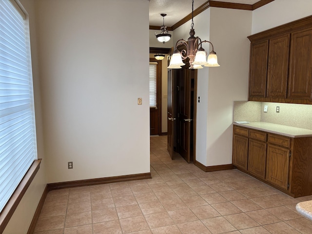 1470 Sheridan Ln, Beaumont, TX 77706 - kitchen featuring a chandelier, decorative backsplash, light countertops, light tile patterned flooring, and crown molding