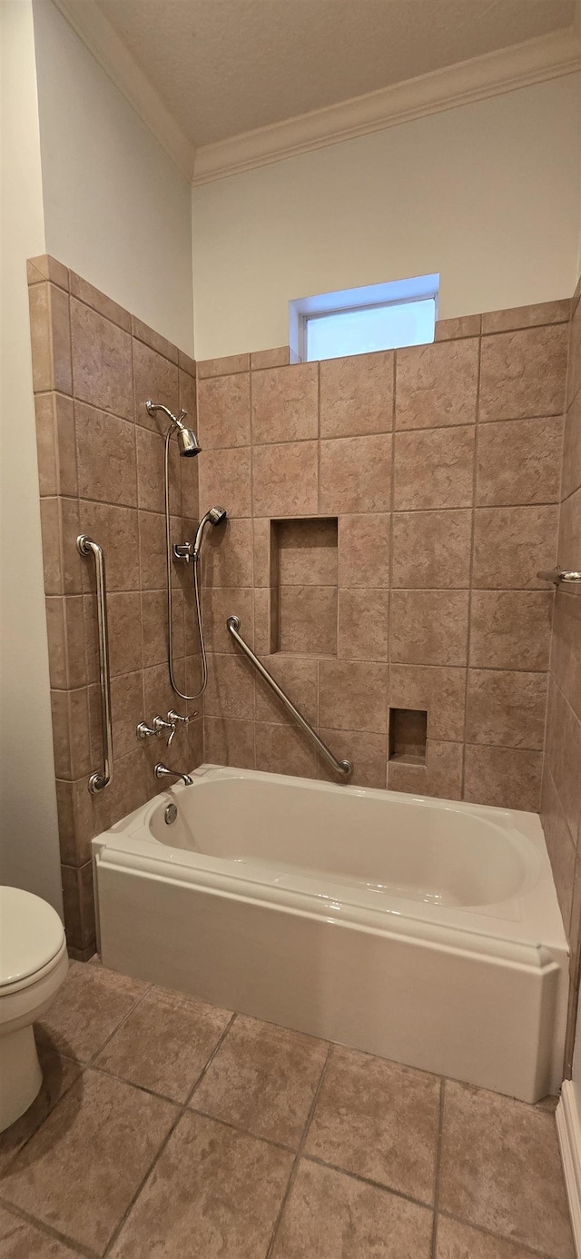 full bathroom featuring tile patterned floors, toilet, washtub / shower combination, and ornamental molding