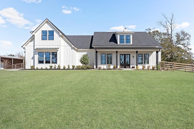 view of front of house with a front lawn and french doors