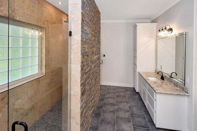 bathroom featuring vanity, a tile shower, and ornamental molding