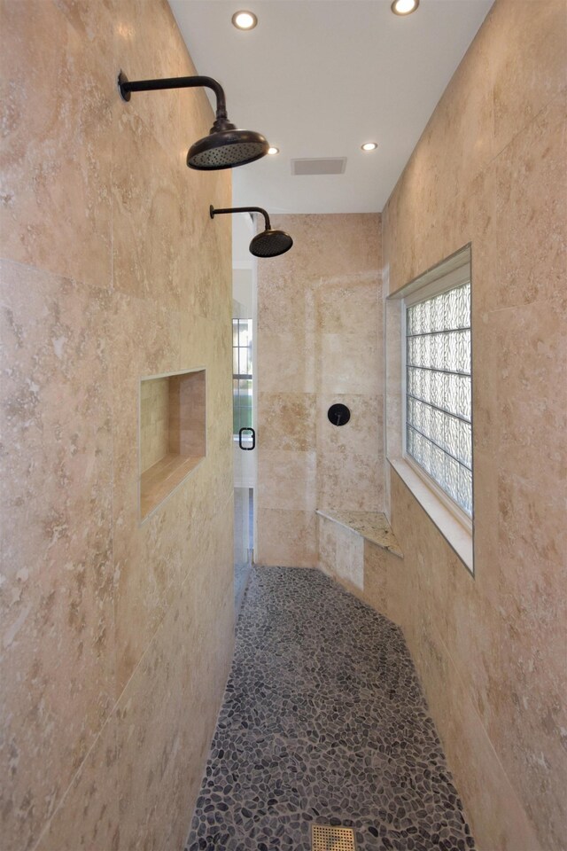 interior space featuring a tile shower