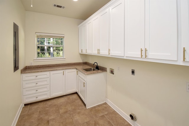 laundry room with cabinets, electric panel, sink, washer hookup, and hookup for an electric dryer