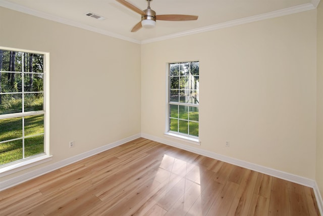 spare room with light hardwood / wood-style floors, ceiling fan, and ornamental molding