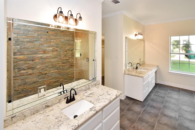 bathroom featuring vanity, a shower with door, and crown molding