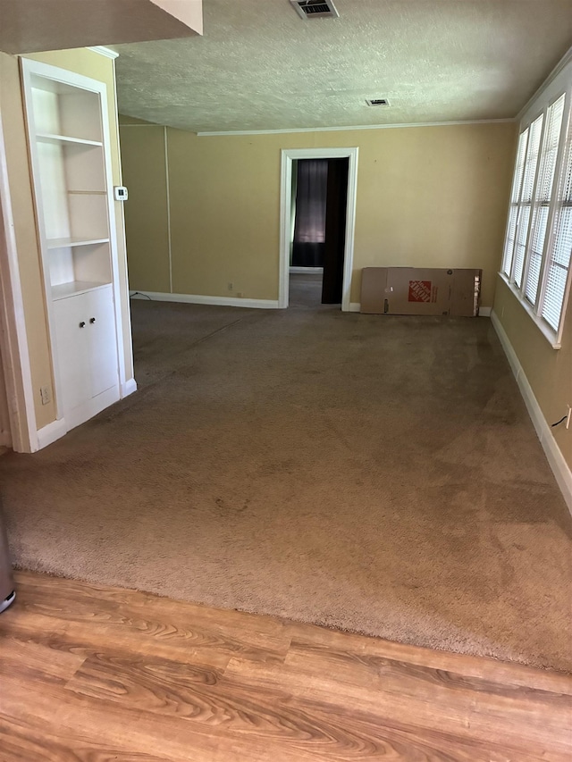 2515 Glenwood Dr, Port Arthur, TX 77642 - empty room featuring carpet floors and a textured ceiling
