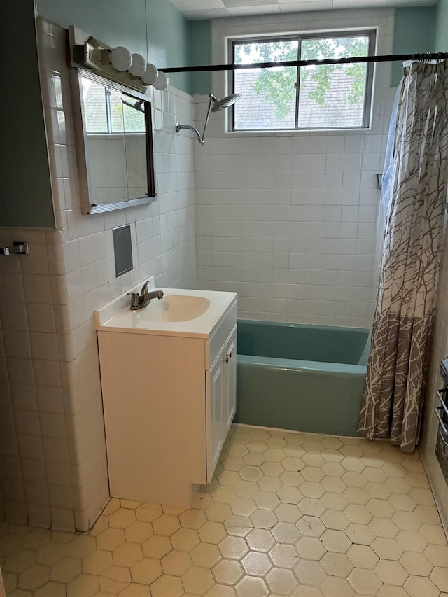 2515 Glenwood Dr, Port Arthur, TX 77642 - bathroom with shower / tub combo with curtain, tile walls, vanity, healthy amount of natural light, and tile patterned floors