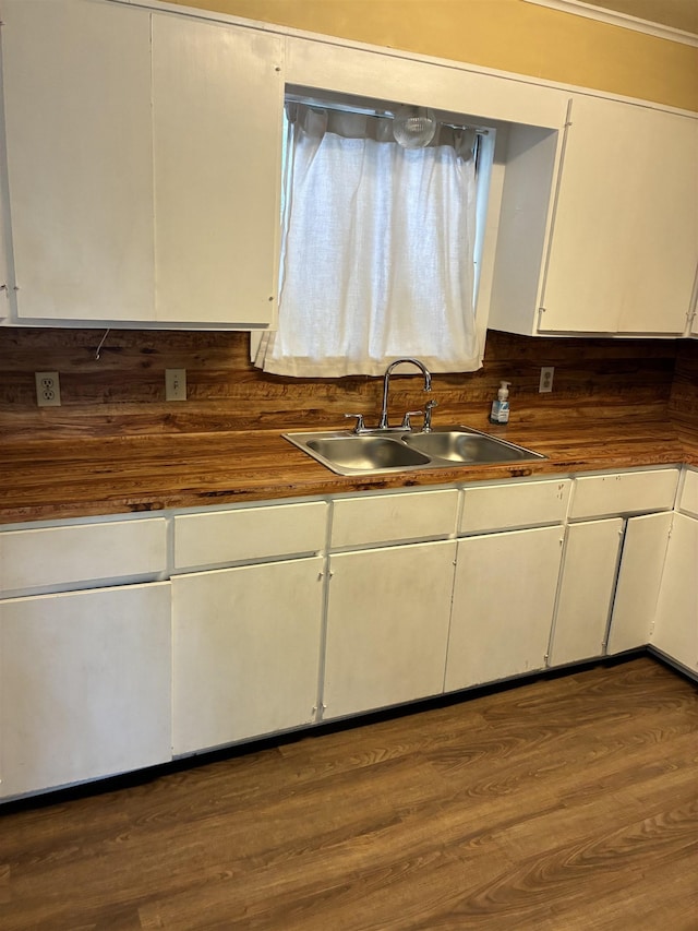2515 Glenwood Dr, Port Arthur, TX 77642 - kitchen with white cabinetry and dark wood-style floors