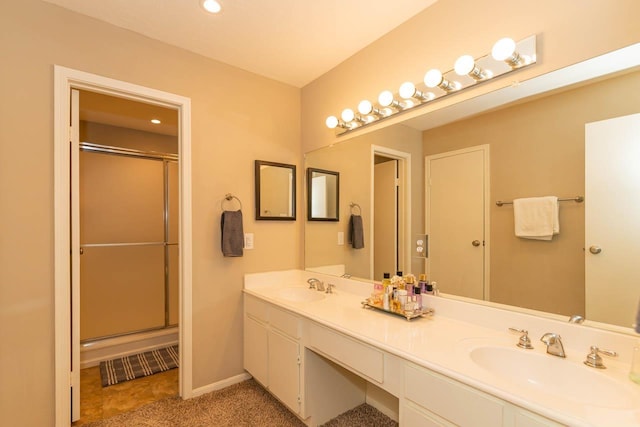 1620 Wellington Pl, Beaumont, TX 77706 - bathroom with double vanity, a shower with door, recessed lighting, and baseboards