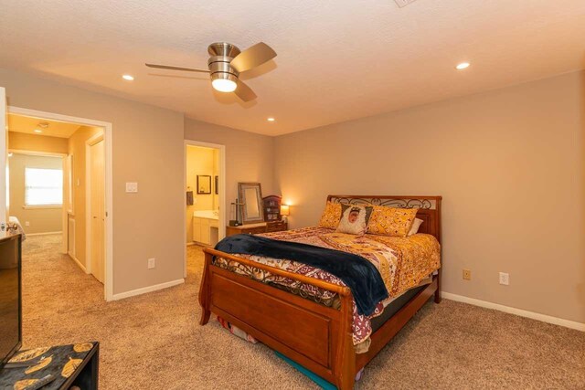 1620 Wellington Pl, Beaumont, TX 77706 - bedroom with light carpet, baseboards, recessed lighting, and ensuite bathroom