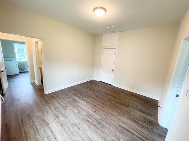 unfurnished room featuring dark hardwood / wood-style flooring