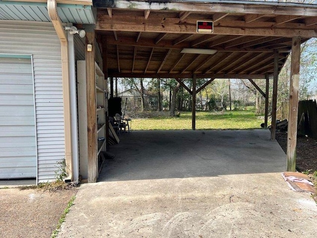 view of parking / parking lot featuring a carport