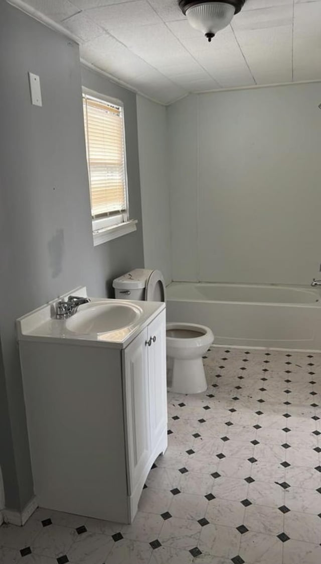 full bathroom with vanity, bathtub / shower combination, and toilet