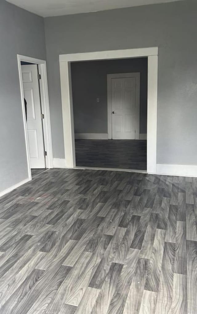 unfurnished room featuring hardwood / wood-style flooring