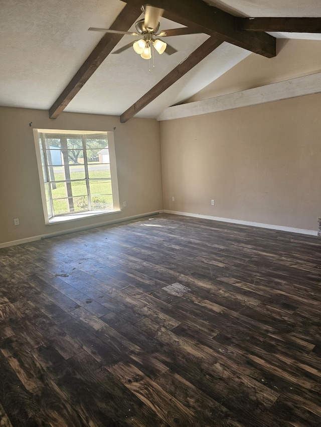 spare room featuring dark hardwood / wood-style flooring, lofted ceiling with beams, and ceiling fan