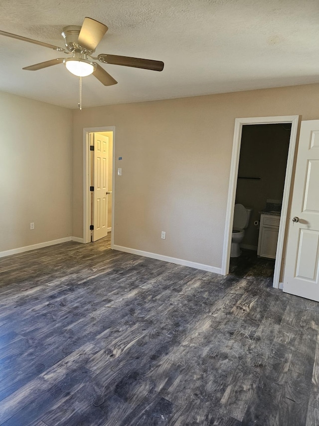 unfurnished room featuring ceiling fan and dark hardwood / wood-style flooring