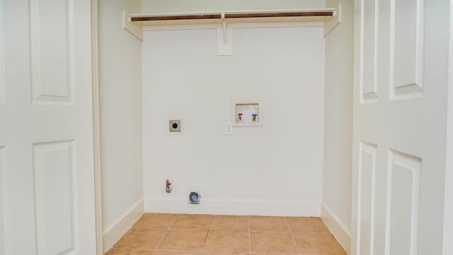 2650 Cedar Spgs, Port Arthur, TX 77640 - washroom with washer hookup, gas dryer hookup, electric dryer hookup, light tile patterned floors, and baseboards