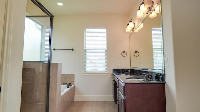 2650 Cedar Spgs, Port Arthur, TX 77640 - bathroom with double vanity, a garden tub, tile patterned flooring, and baseboards