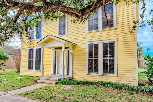 view of front of home with a front yard