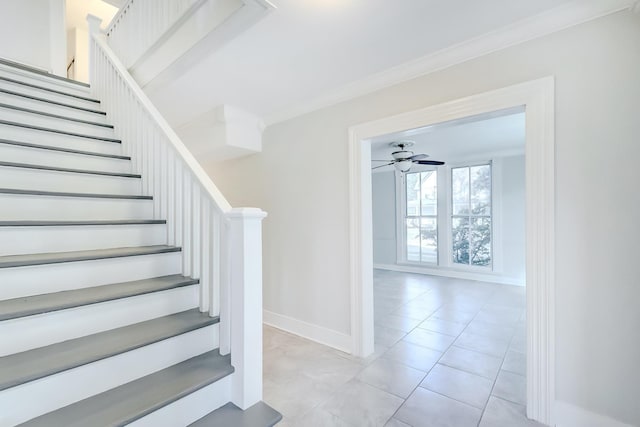 stairway featuring tile patterned floors, ceiling fan, and ornamental molding