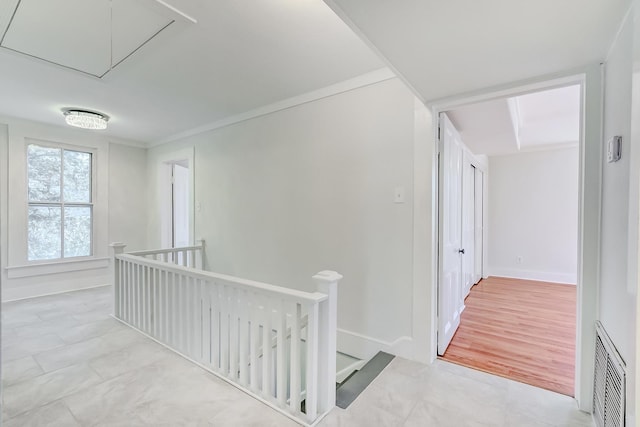 hallway featuring crown molding