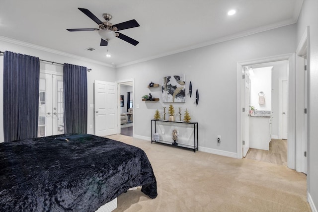 bedroom featuring ensuite bath, ceiling fan, crown molding, and light colored carpet