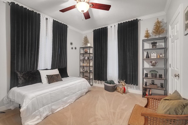 bedroom with carpet, ceiling fan, and crown molding