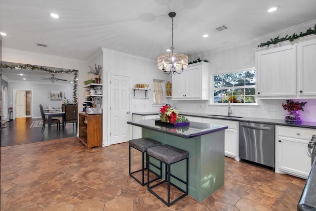 kitchen featuring white cabinetry, dishwasher, ceiling fan with notable chandelier, and sink