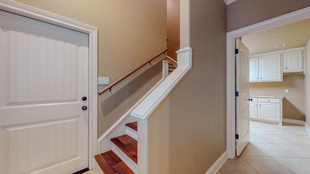 stairs with tile patterned flooring