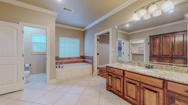 bathroom featuring ornamental molding, tile patterned floors, and a bathing tub