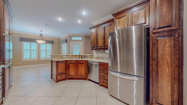 kitchen with sink, crown molding, light stone countertops, appliances with stainless steel finishes, and tasteful backsplash