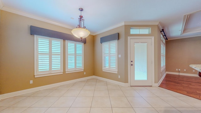 tiled foyer featuring crown molding