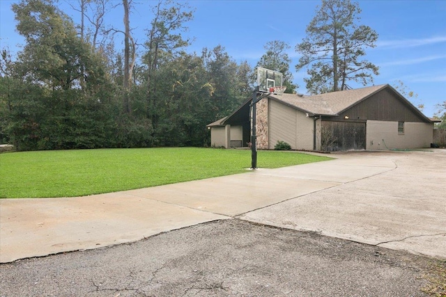 view of side of property with a lawn