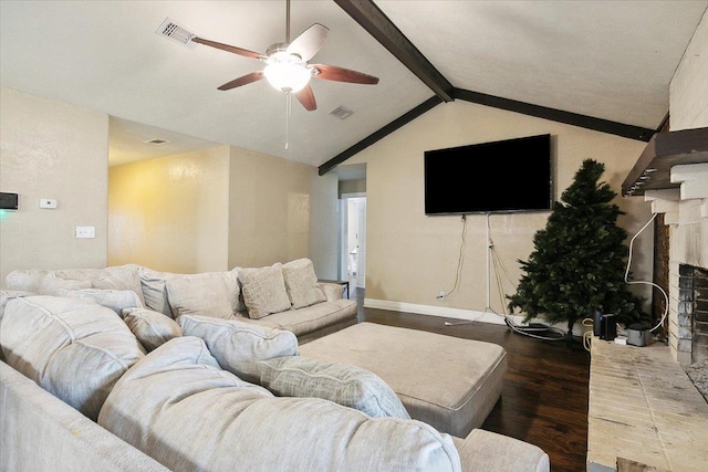 living room with a fireplace, vaulted ceiling with beams, ceiling fan, and dark wood-type flooring