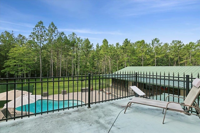 view of patio with a fenced in pool