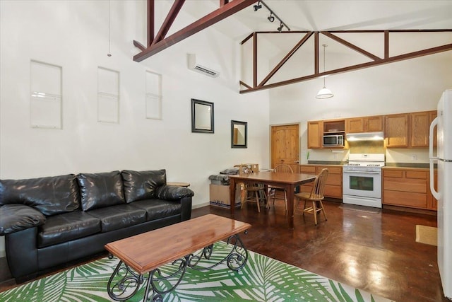 living room with high vaulted ceiling and a wall mounted air conditioner