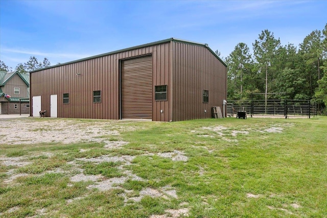 view of outbuilding featuring a yard