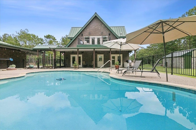 view of swimming pool with a patio